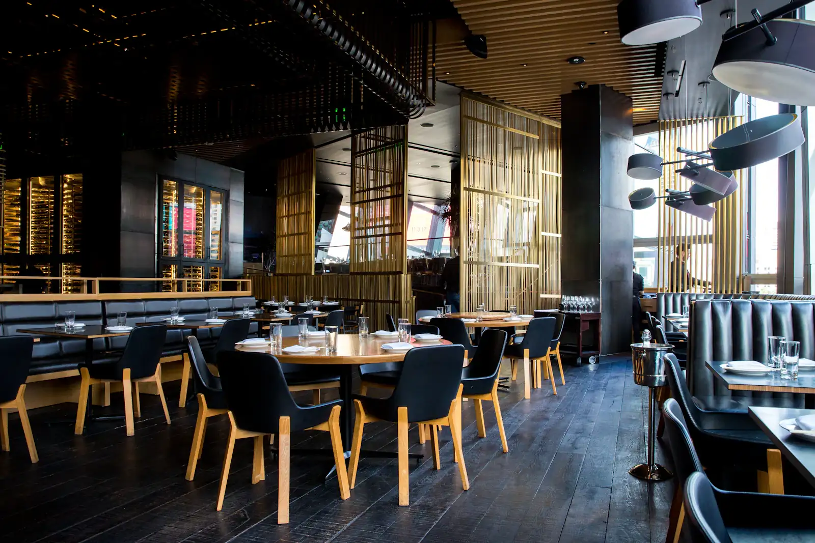 A restaurant dining room set for evening service